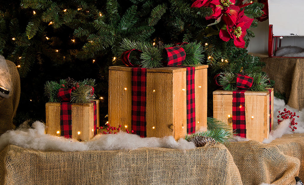 Holiday boxes decorated with ribbon and lights.