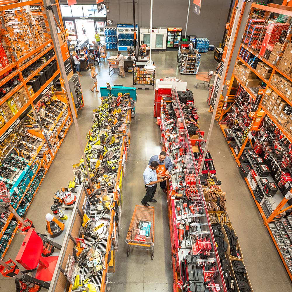 An Associate helps a customer inside The Home Depot Store