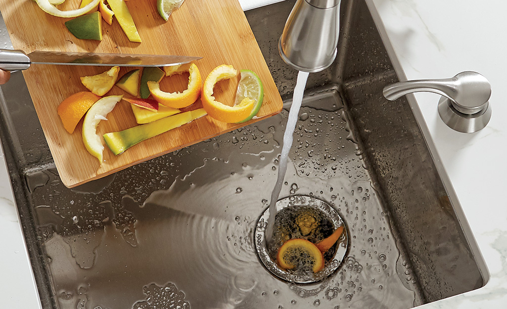 A garbage disposal grinds fruit and vegetable waste.