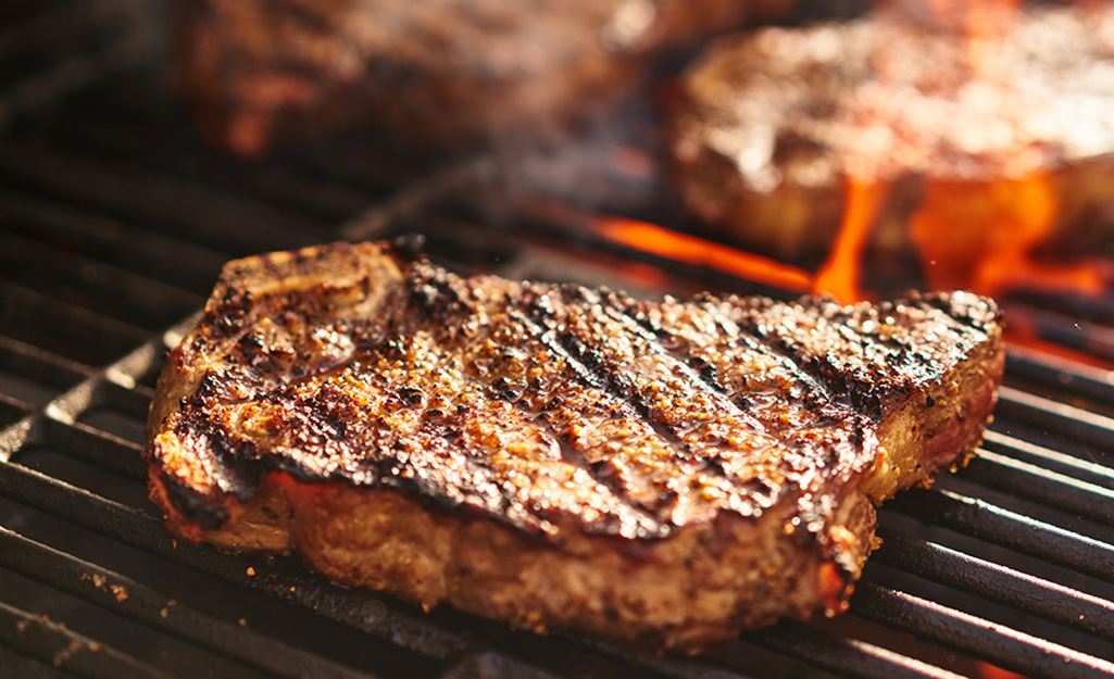 Steak searing on a hot grill.