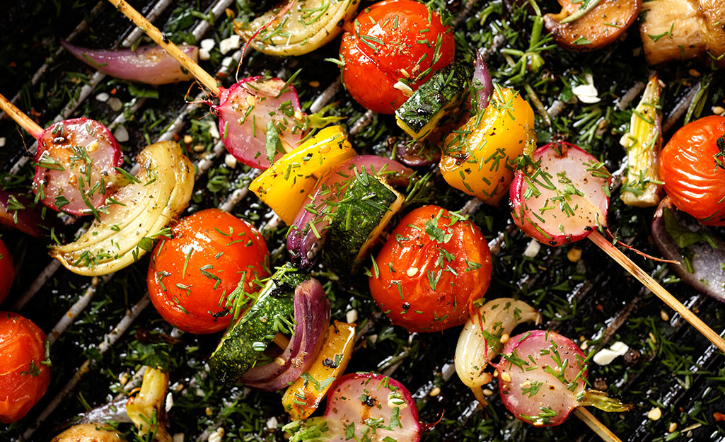 Skewered vegetables on a grill Skewered vegetables on a grill