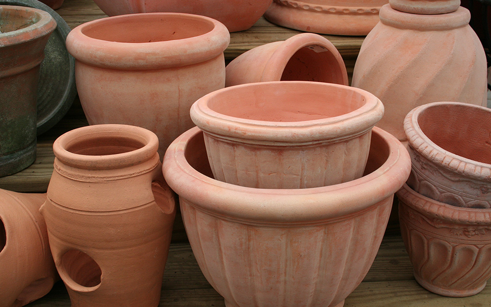 Assorted terra cotta planters in various shapes and sizes Assorted terra cotta planters in various shapes and sizes