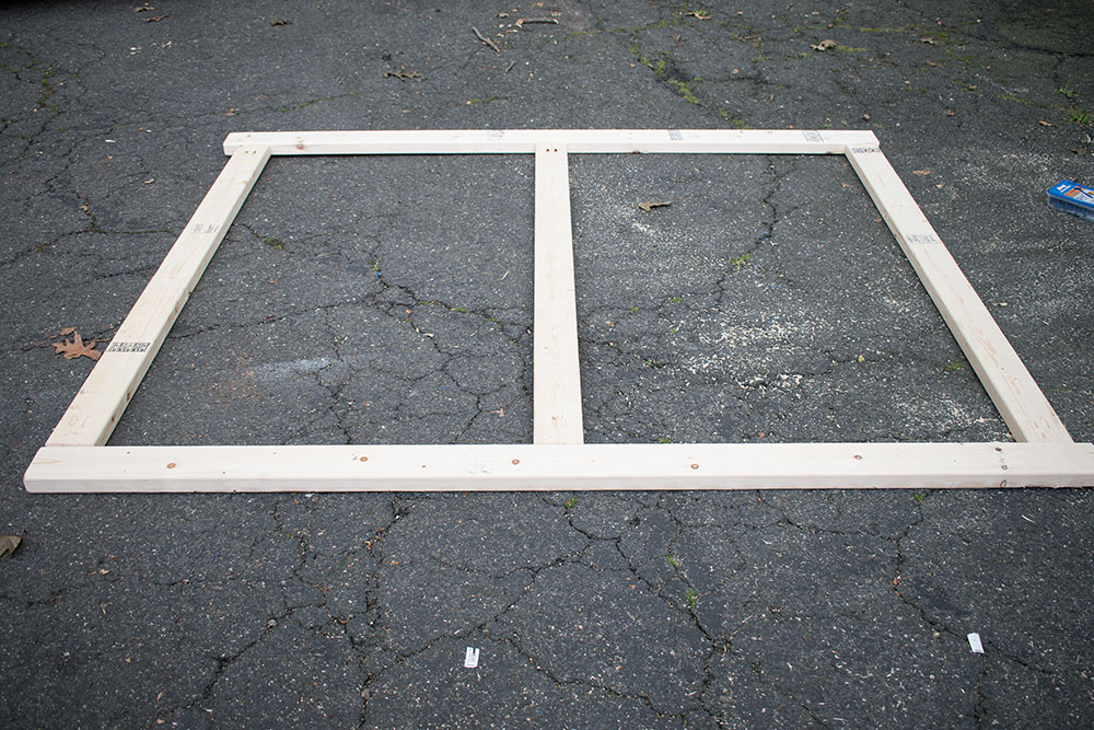 A photo of a wood frame on the ground 