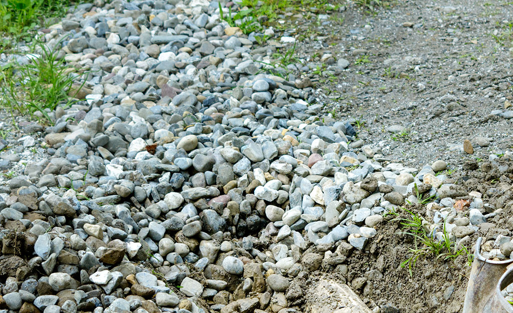 A French drain system hidden underneath landscaping stones.