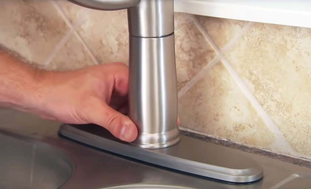 A single handle faucet in a chrome finish.