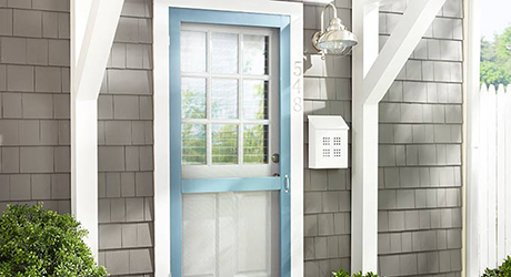 A white wall-mounted mailbox.