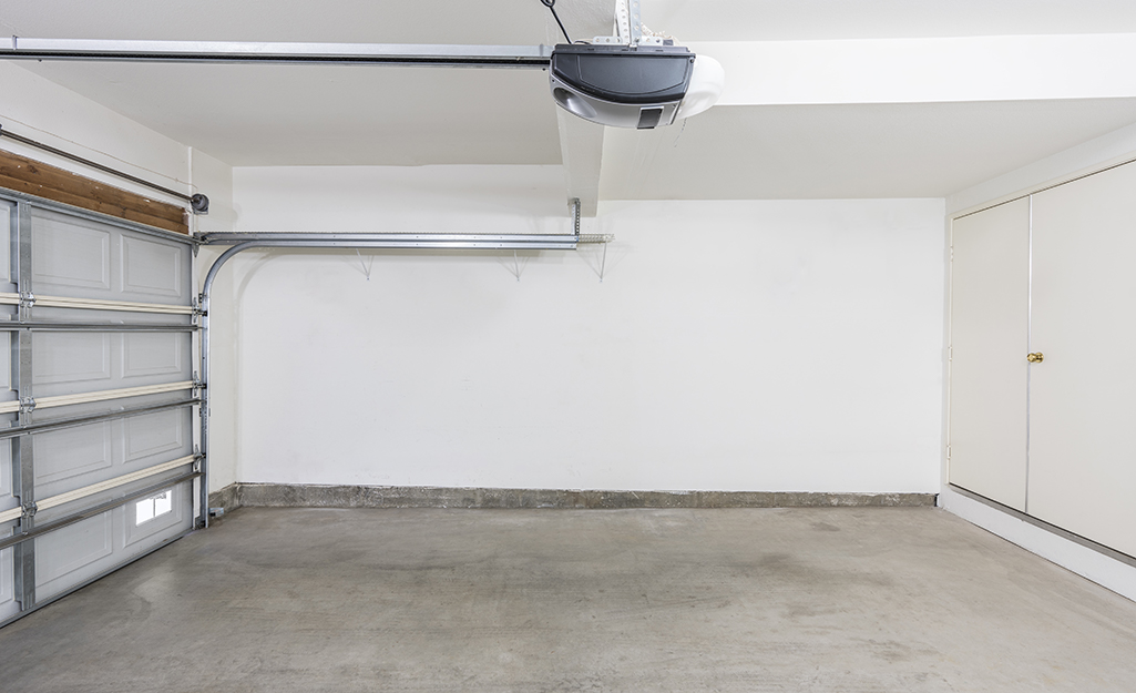 A blank wall in an empty garage.