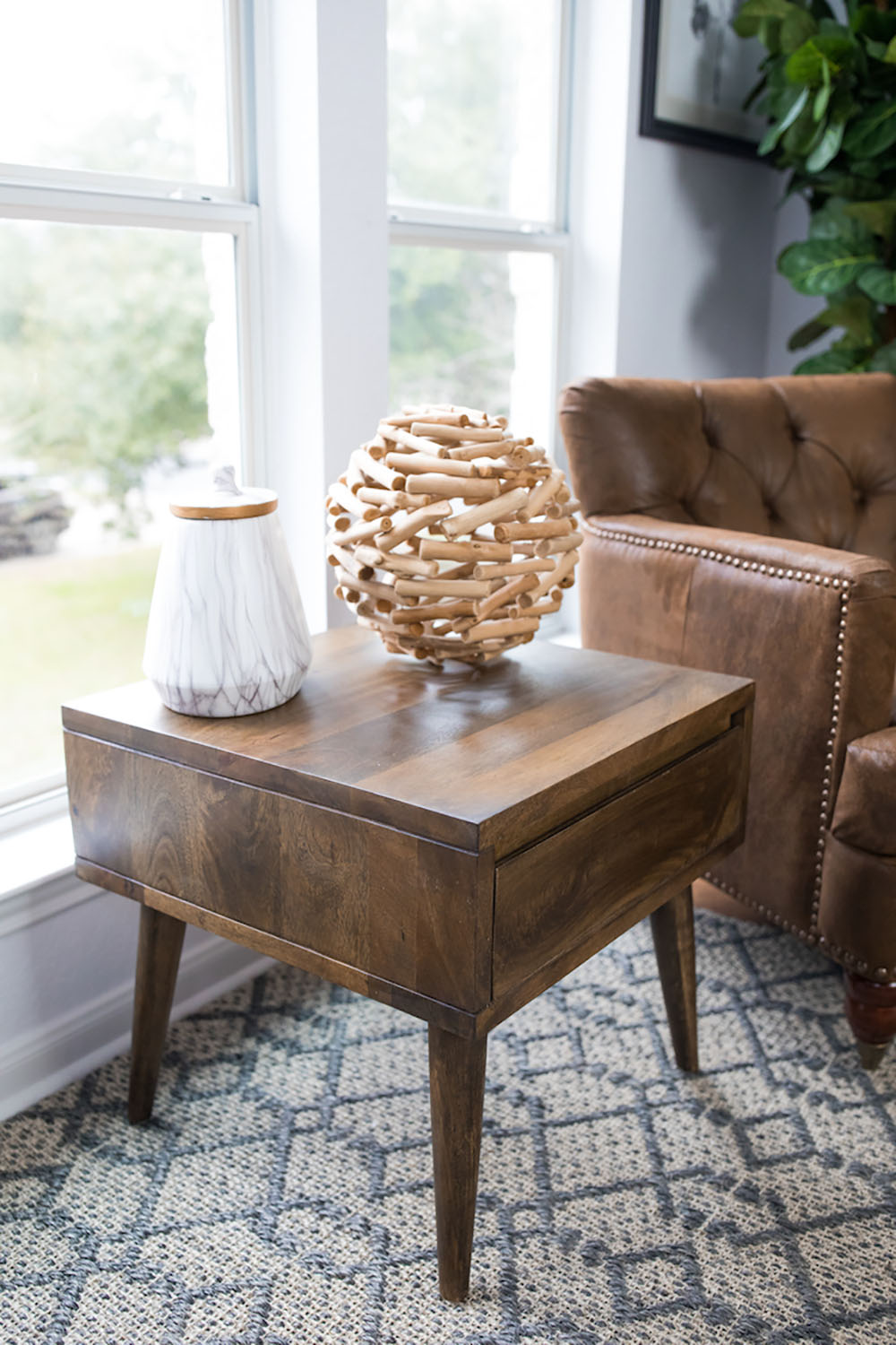 A side table with decor on top