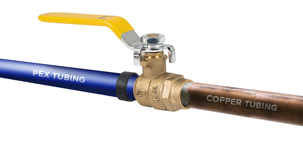 A shut-off valve connecting pex tubing and copper tubing.