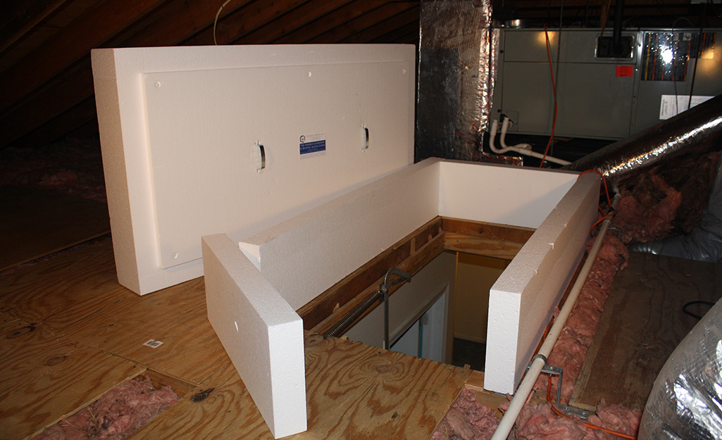 An insulation barrier for an attic ladder access hatch.