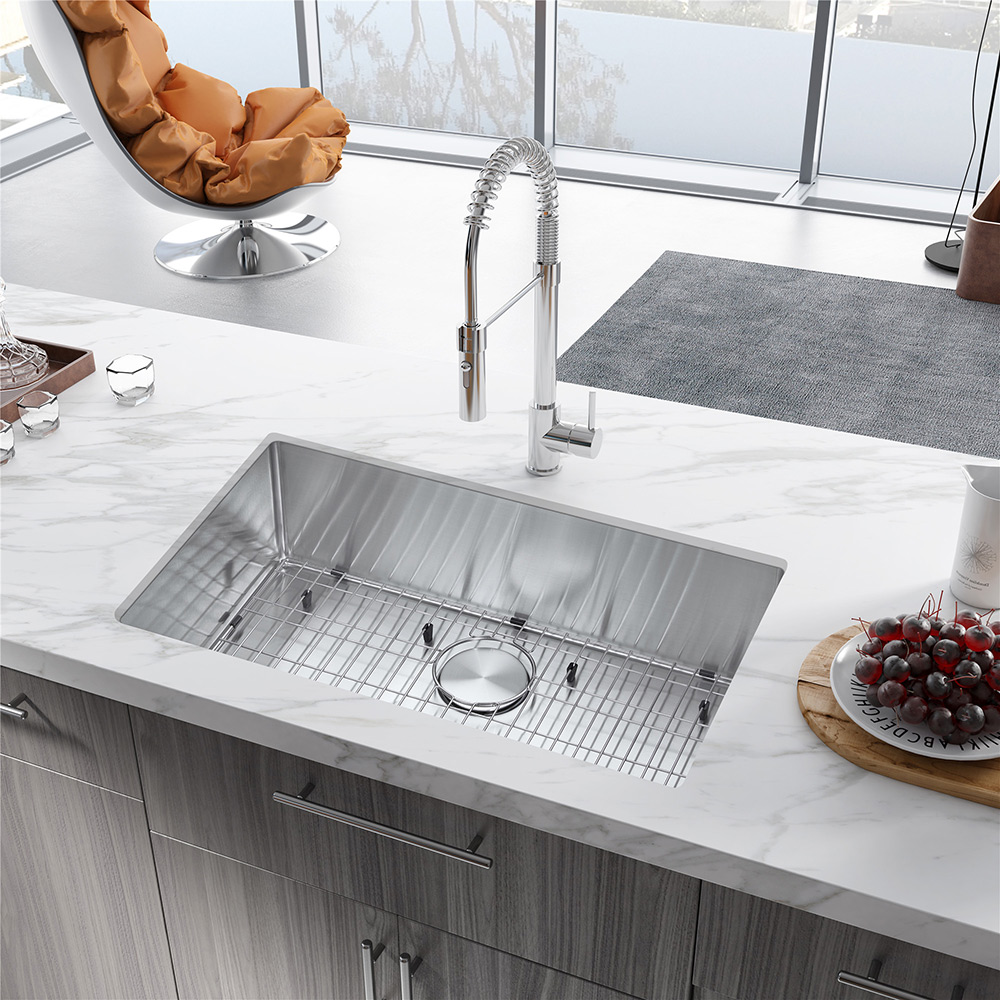 An undermount sink is built into a kitchen countertop.