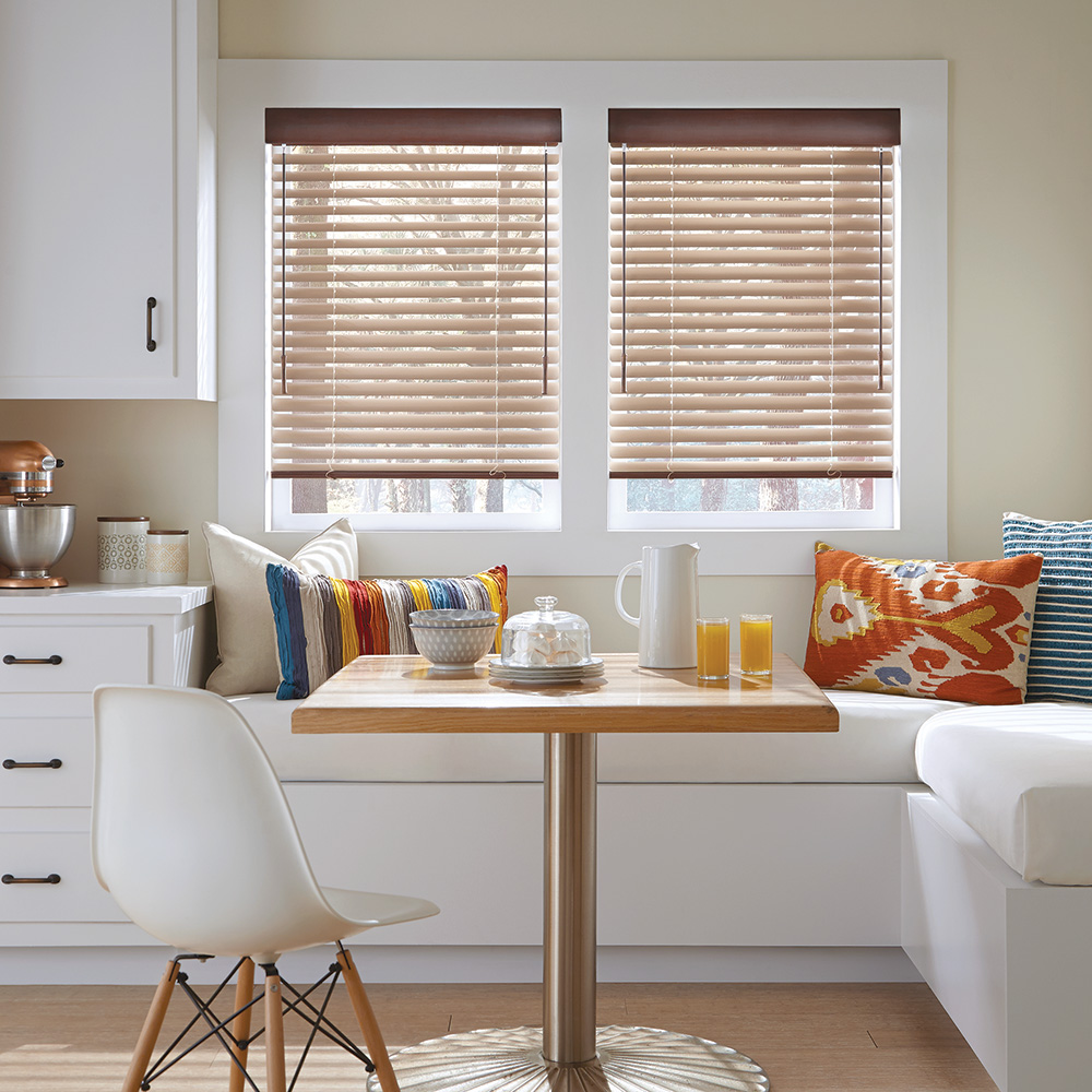 Blinds on a window in a dining nook.