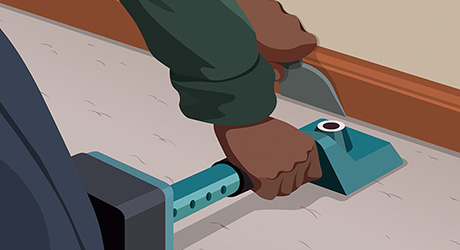 Step 5: Person Using Knee Kicker to Anchor Carpet Along Wall Step 5: Person Using Knee Kicker to Anchor Carpet Along Wall