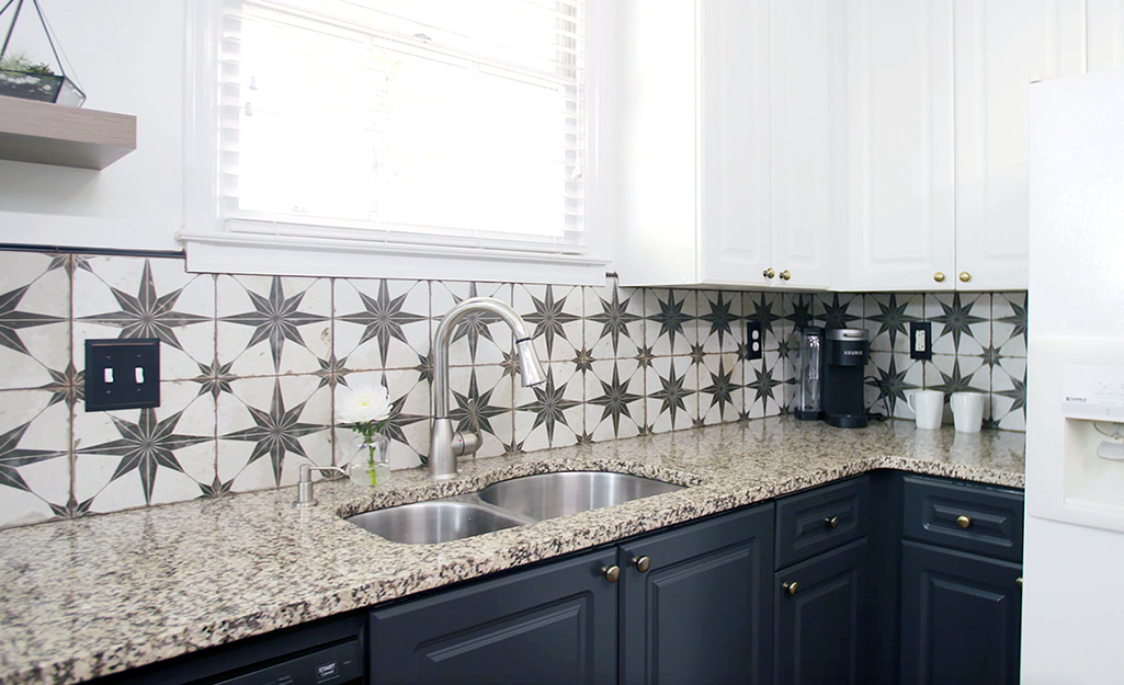 Kitchen featuring a new tile backsplash.