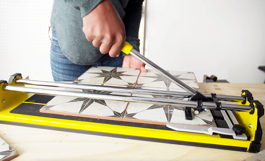 Someone cutting tile.