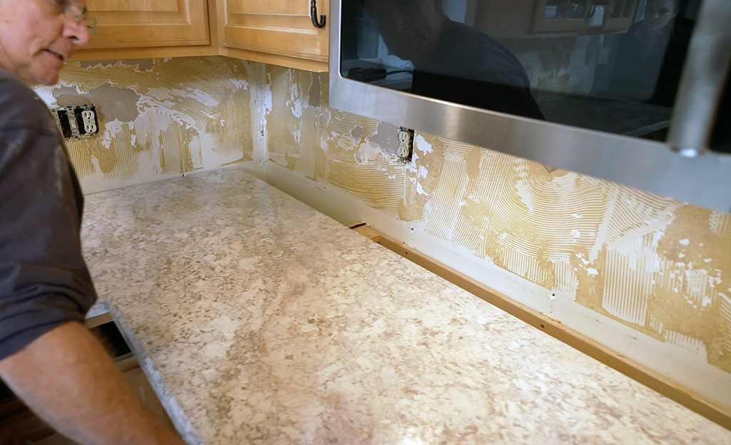 A new laminate countertop is installed.