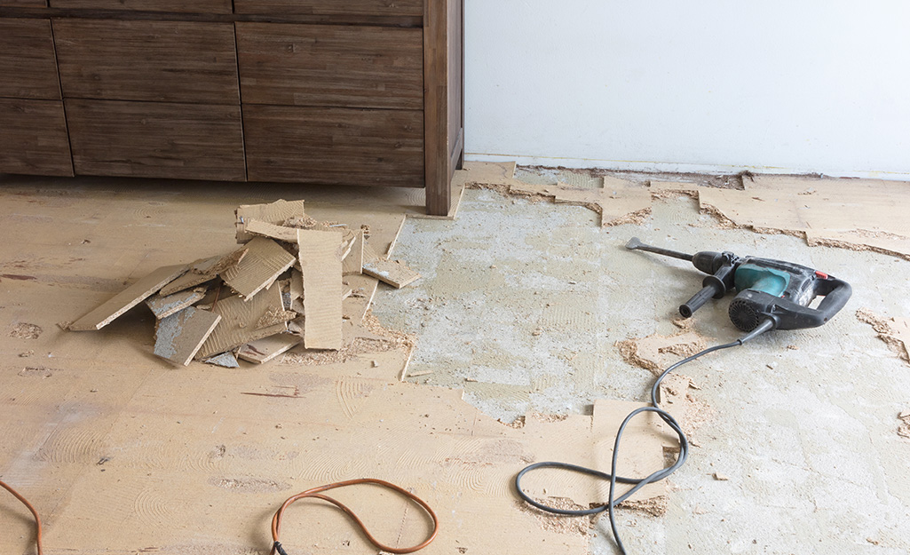 A tile floor that has been partially removed.