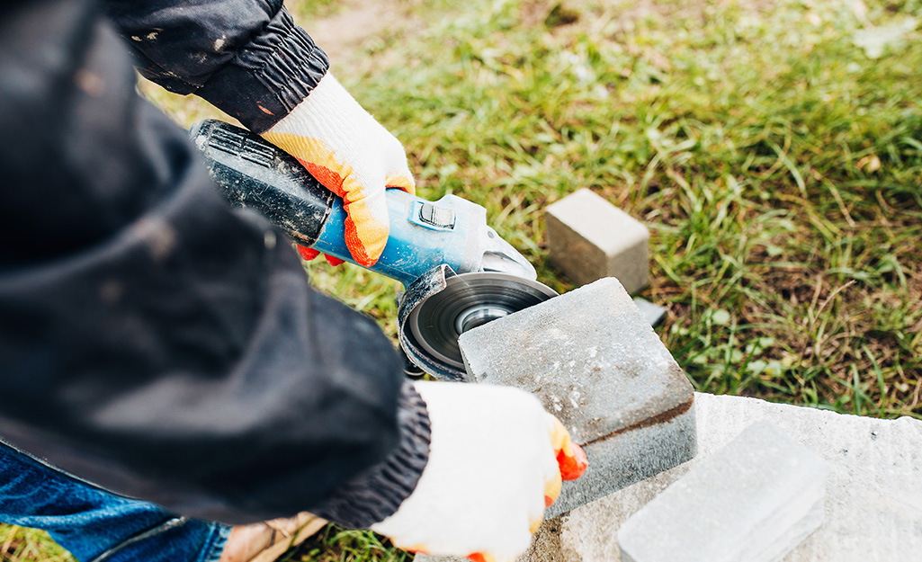 Paver stones are cut to fit in place.