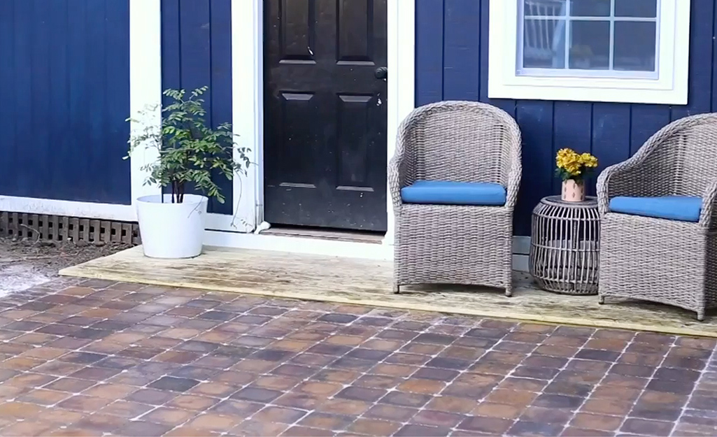 A porch is finished with patio pavers.