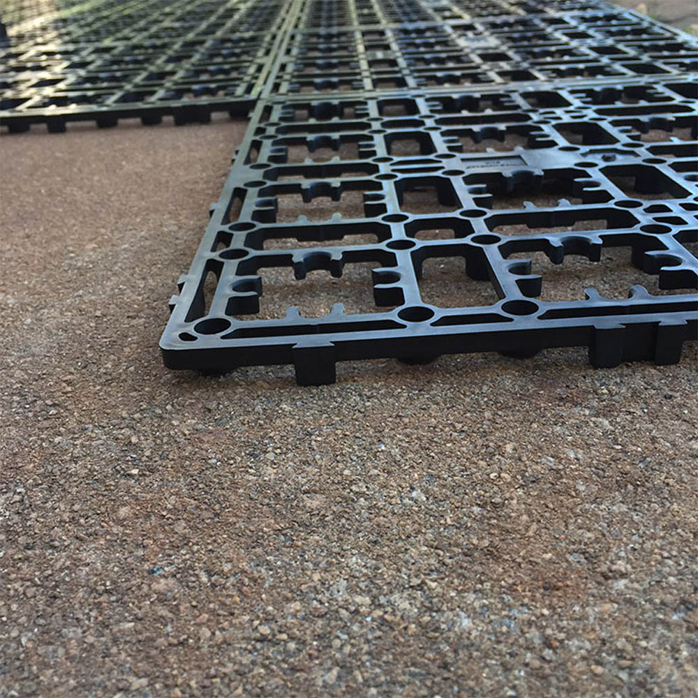 A concrete patio is covered in a Deck-a-Floor system.