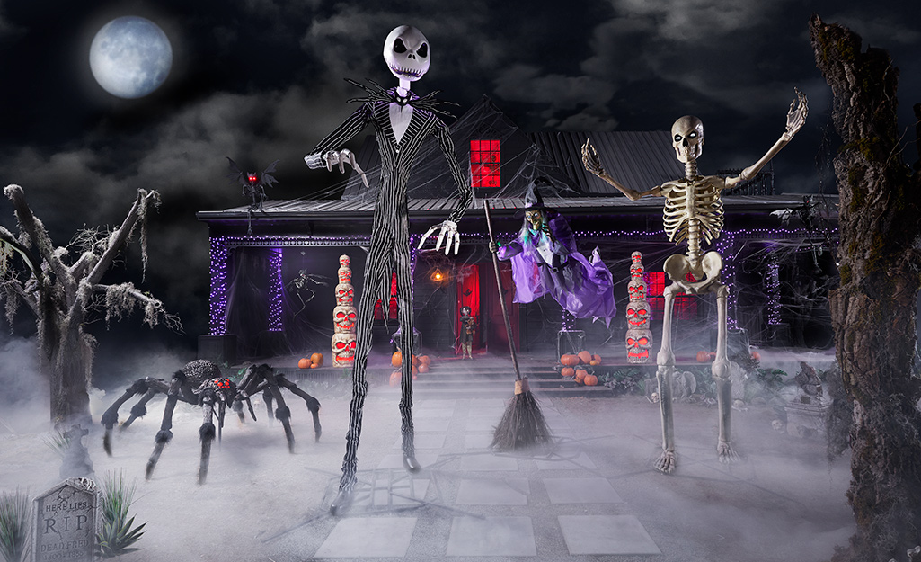 A front yard filled with Jack Skellington, the 12-foot skeleton and other large lawn decorations.
