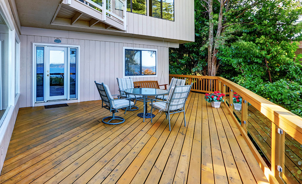 Patio furniture sits on a backyard deck.