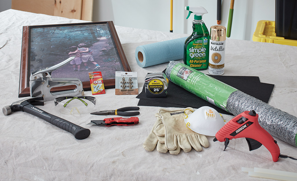 Tools and materials for chicken wire memo board on table