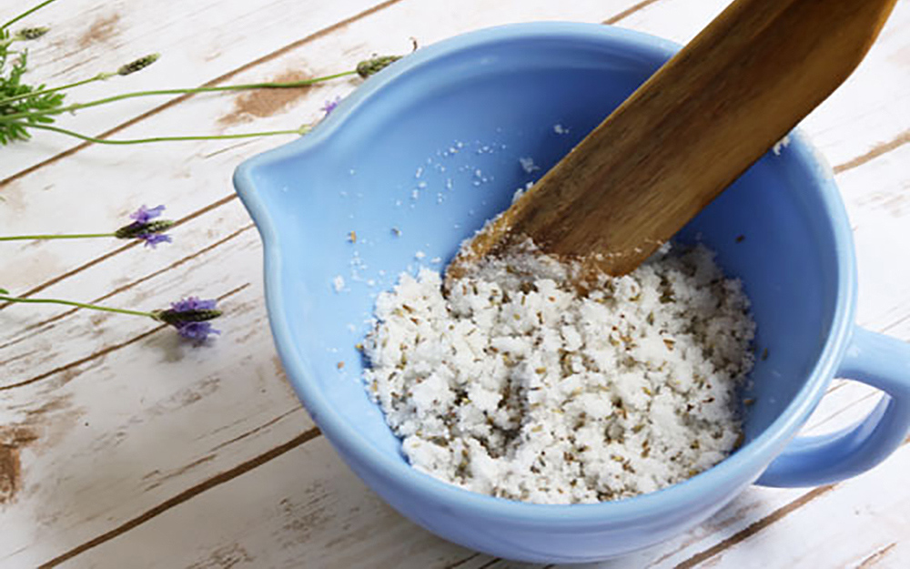 Lavender sugar scrub mixed in a bowl