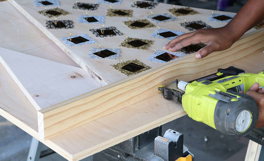 A bottom frame is attached using a nail gun.