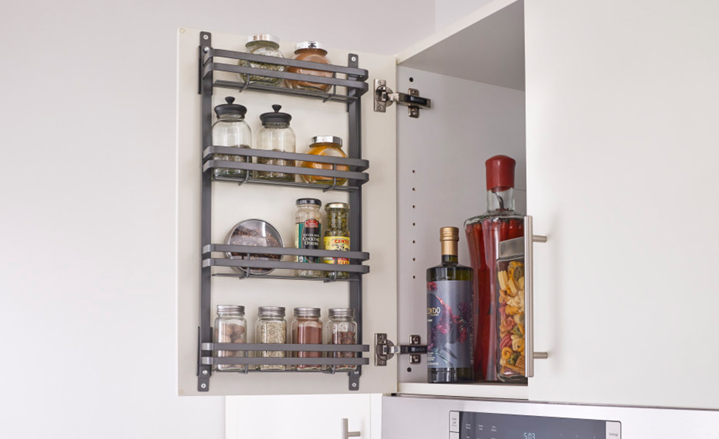 Vertical storage inside white cabinetry.