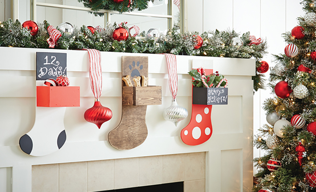 Wood stockings hang from a mantel.