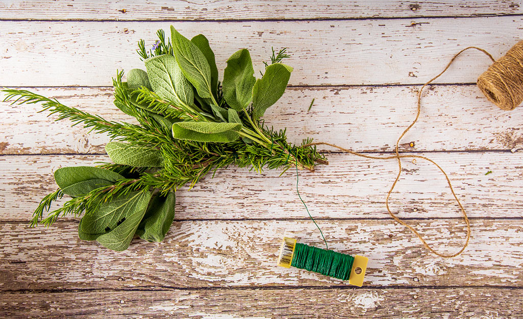 Two herb bundles tied together with twine.