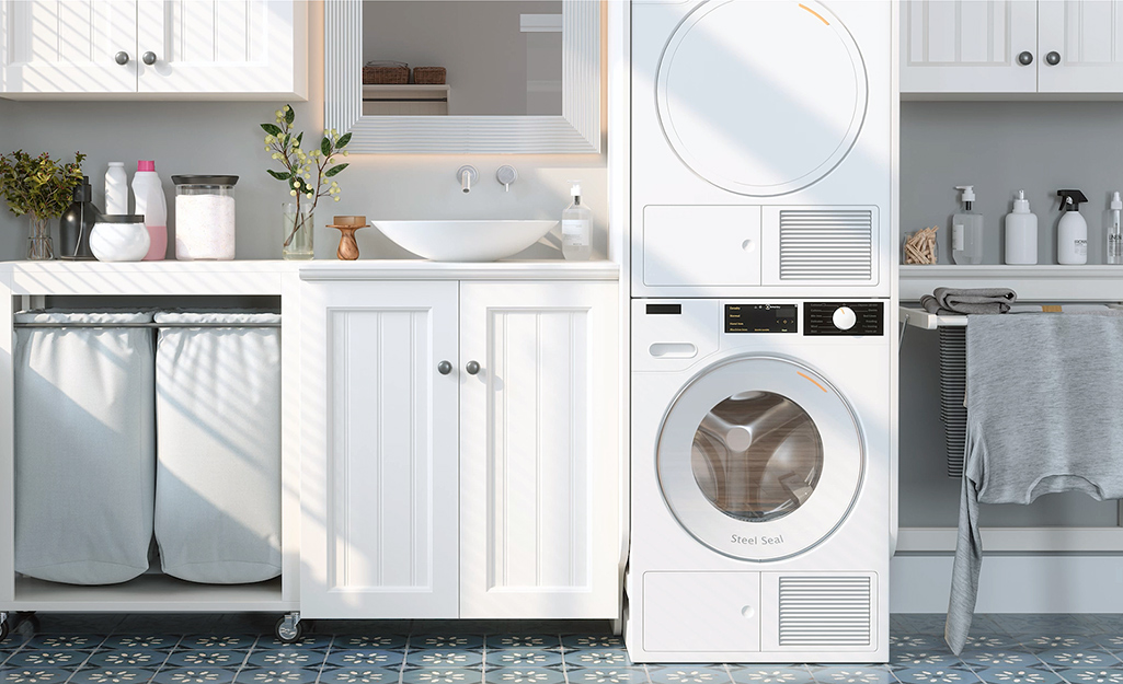 A stacked washer and dryer installed in a laundry room.