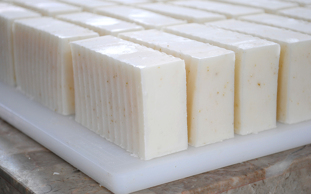 Several rows of freshly sliced homemade soap. Several rows of freshly sliced homemade soap.