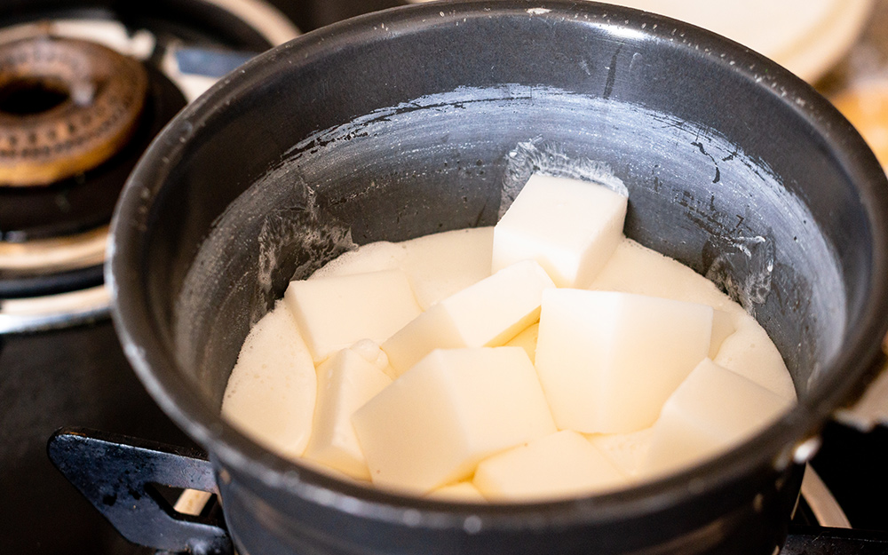 White soap melting in a slow cooker. White soap melting in a slow cooker.