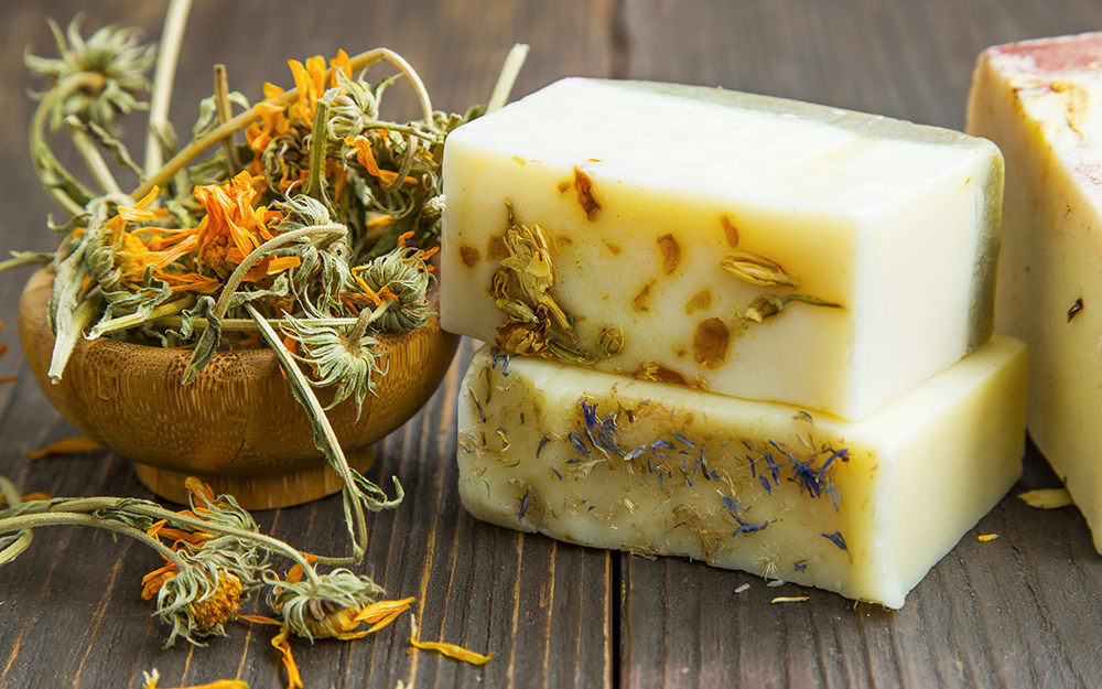Homemade soap with dried flowers on the side. Homemade soap with dried flowers on the side.