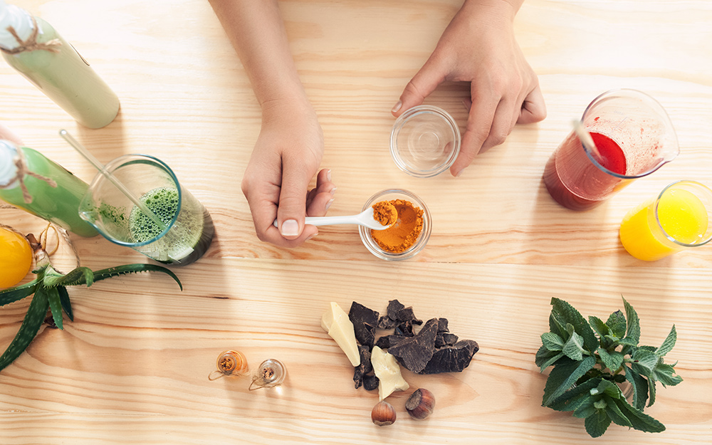 A person measuring out ingredients. A person measuring out ingredients.