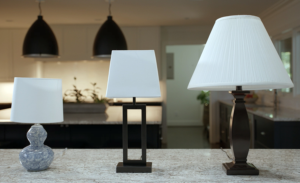 Several different lamp bases featuring different size lamp shades.