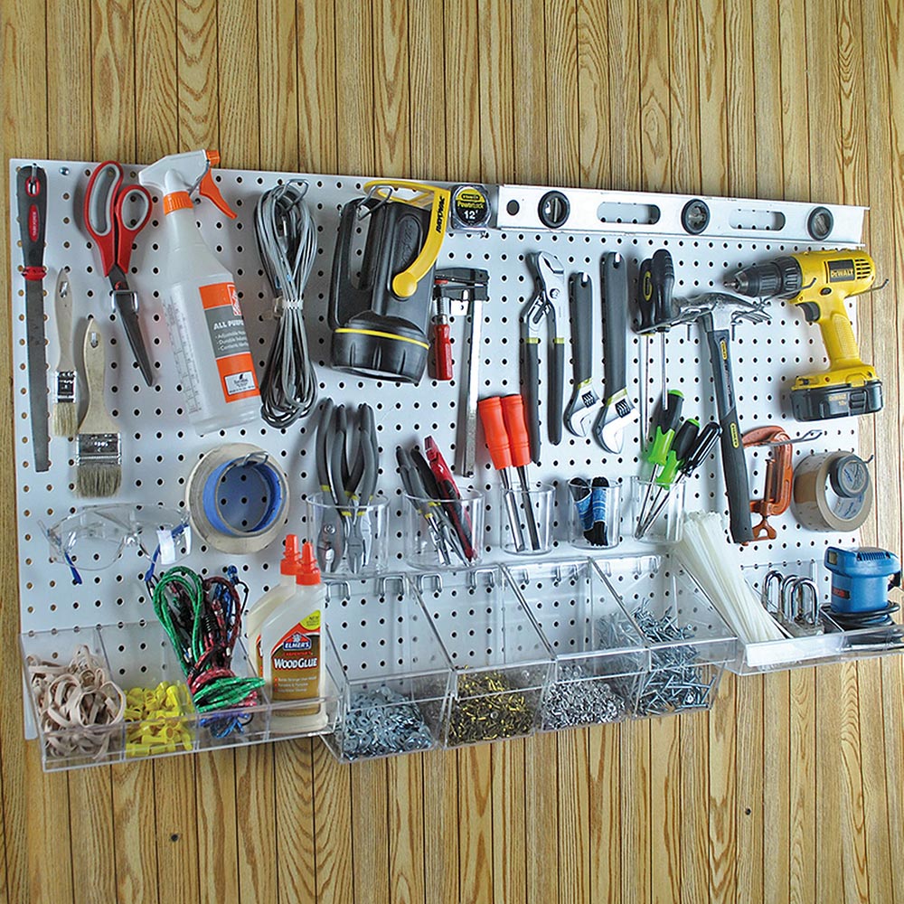 A pegboard with organized tools installed on a wall.