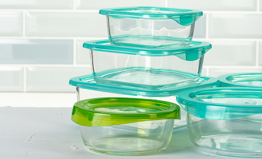A neat stack of plastic food storage containers.