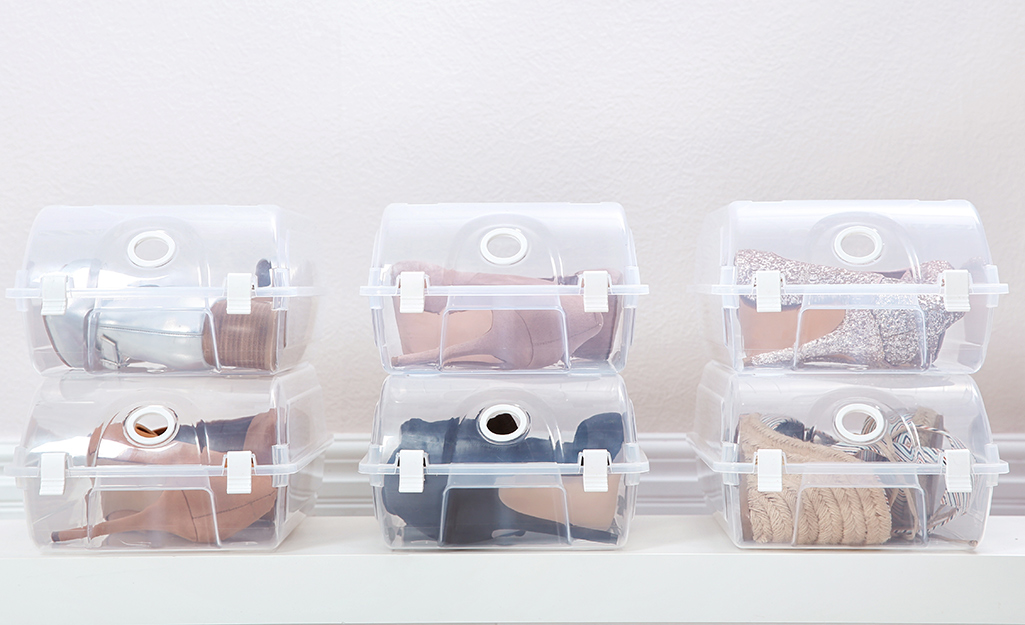 Shoes placed in clear plastic storage containers.