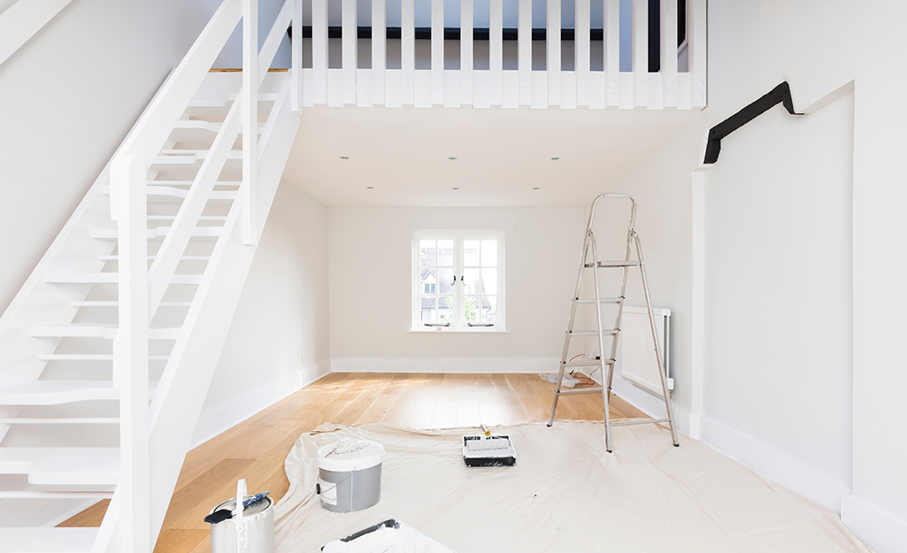 An empty room prepared for painting.