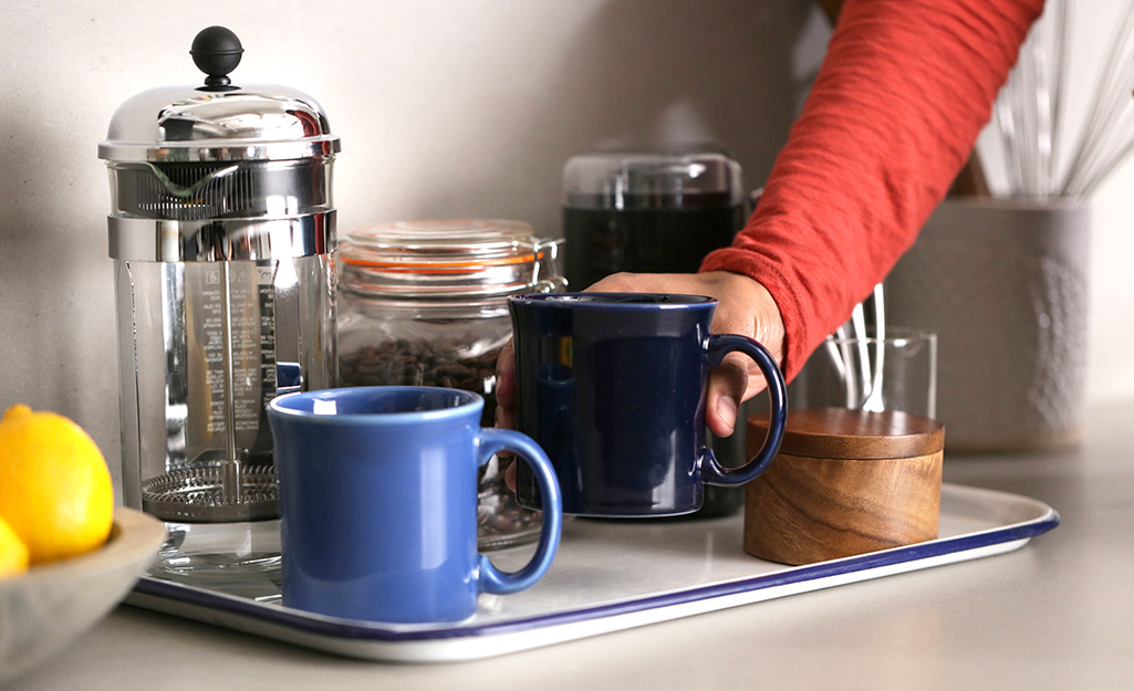 A coffee station is set out for guests.  A coffee station is set out for guests.