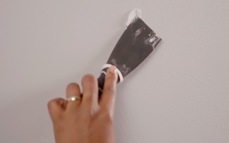 Spackling walls in preparation for painting.