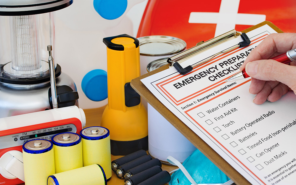 A clipboard holds a checklist of emergency items.