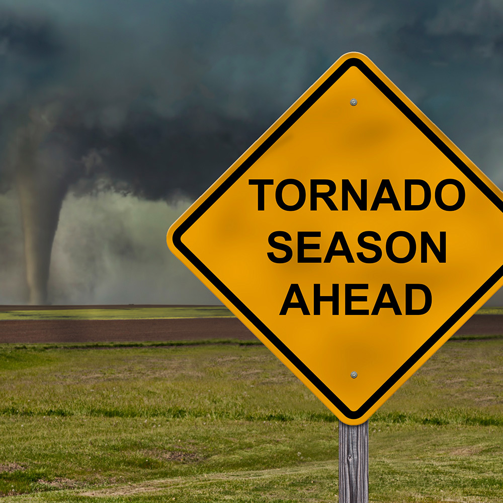Sign placed in front of a tornado.