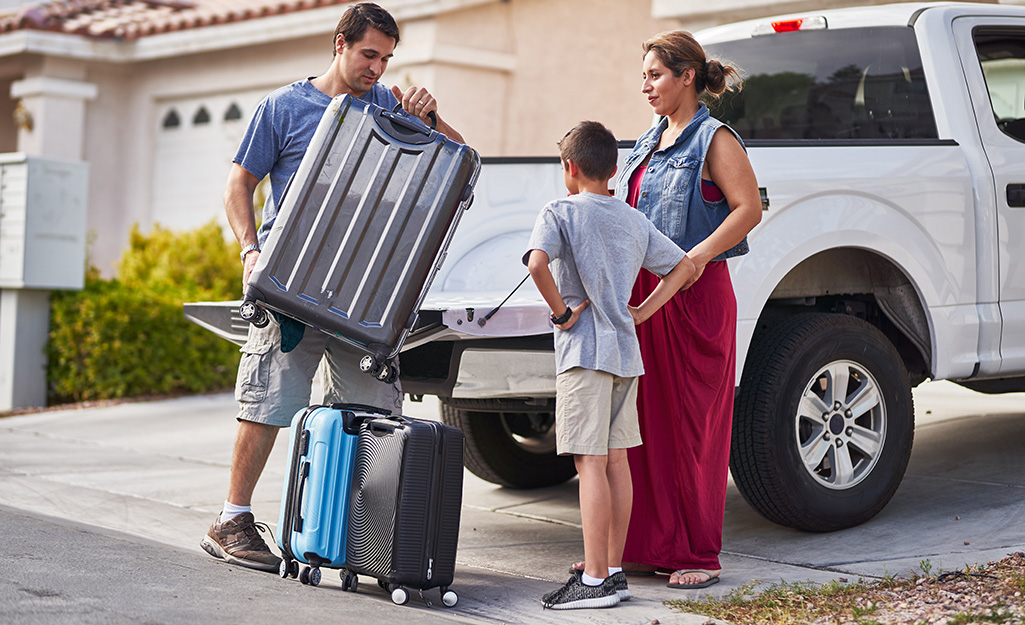 Family packing to evacuate during a wildfire. Family packing to evacuate during a wildfire.