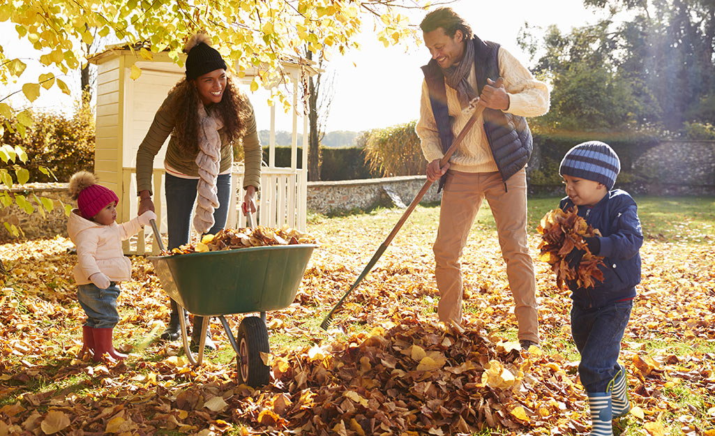 kids raking leaves