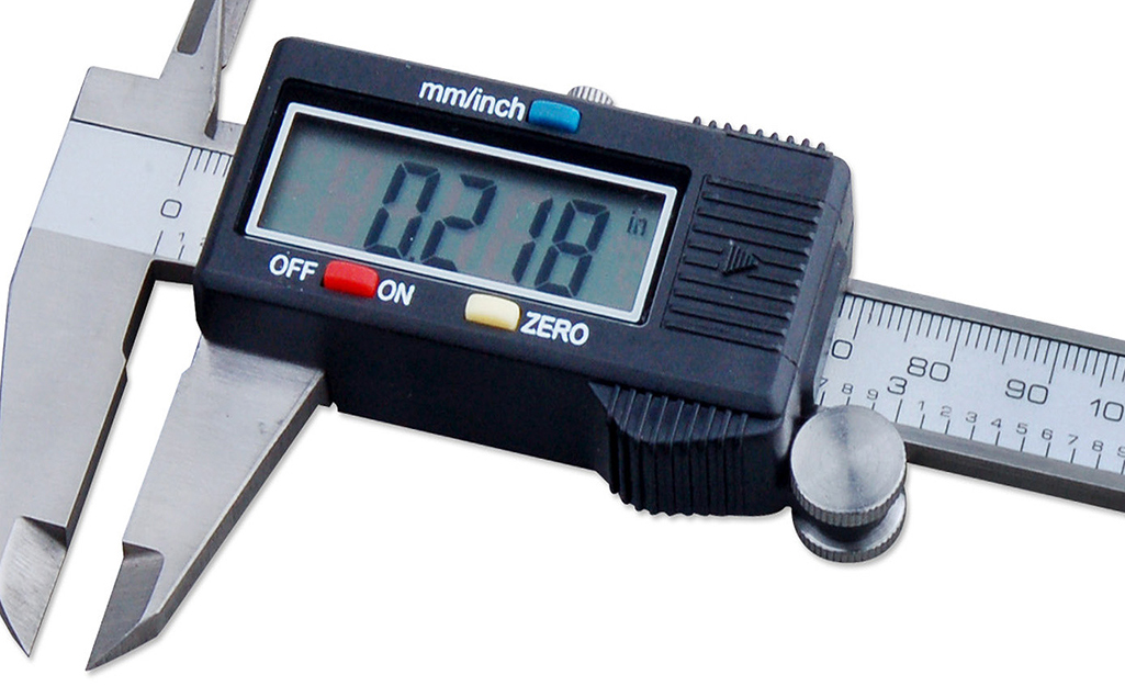 Digital calipers display a measurement.