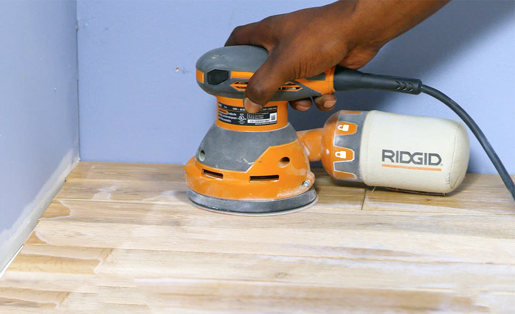 Sanding floor with outlet hand belt sander